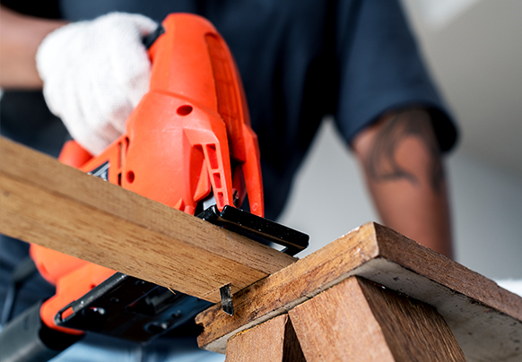 Person cutting wood