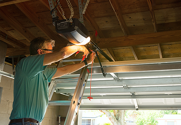 Person repairing garage door