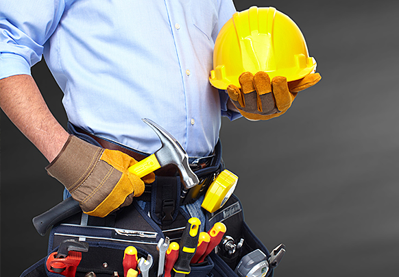 Person standing with tool belt 