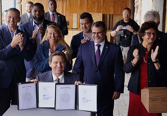 Governor Ron Desantis signing a historic package of insurance reforms