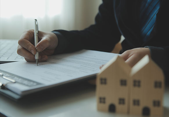 Person reviewing flood documents at desk