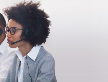 People on phone headsets for new Customer Care Center hours