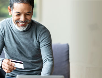 Man with credit card for online payments