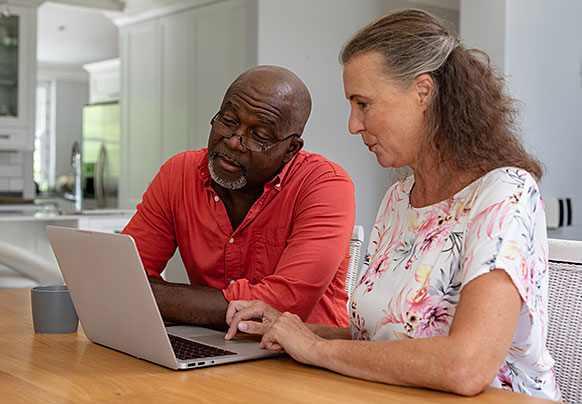 Couple looking at laptop computer