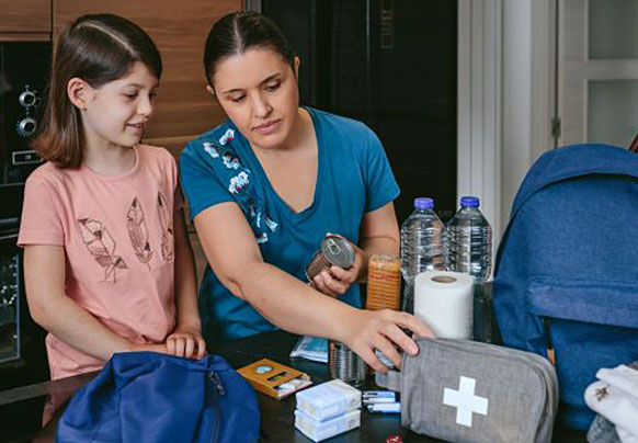 Mom and daughter preparing an emergency kit