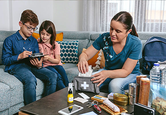Family conducting a midseason hurricane kit check